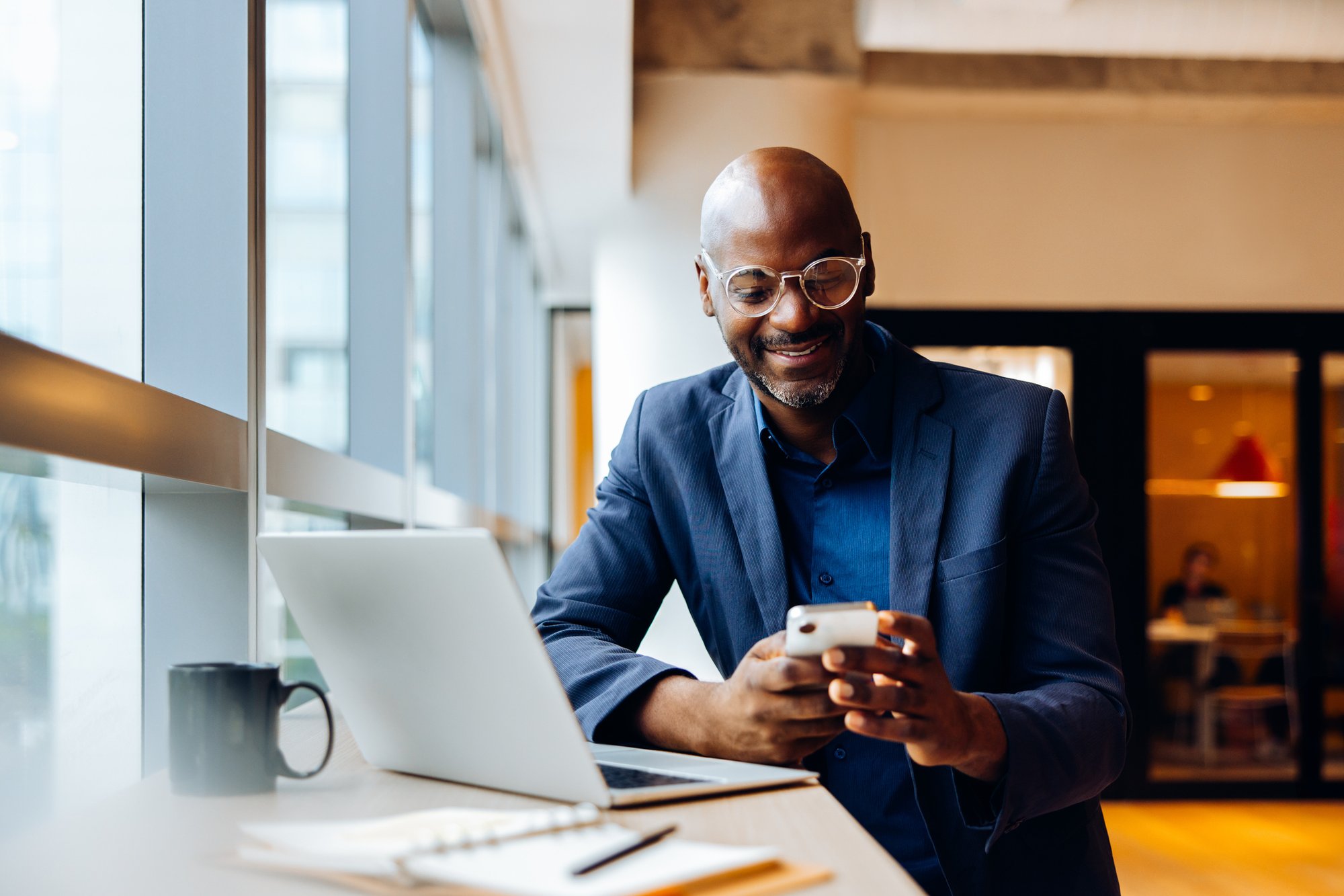 Facing a tough claims decisions - Man looking at phone